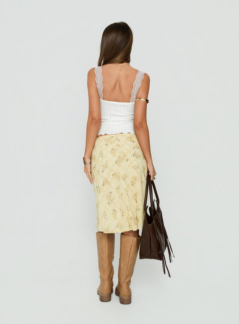 Presenting the Evina Picot Trim Midi Skirt Yellow Paisley womens-skirts with a-line shape, frill details, fitted silhouette, frayed hem, and midi length back view of model wearing Princess Polly