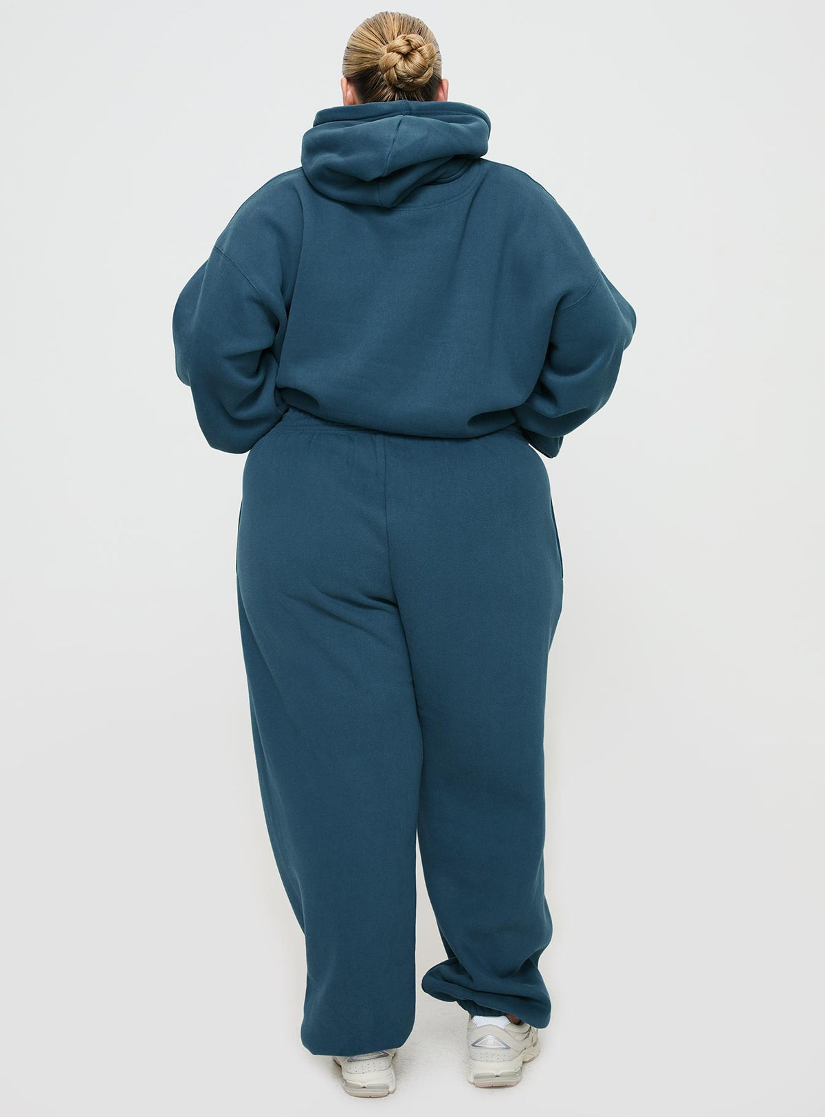 back view of model wearing Princess Polly Princess Polly Track Pants Block / Cursive Text Slate Curve Pants 