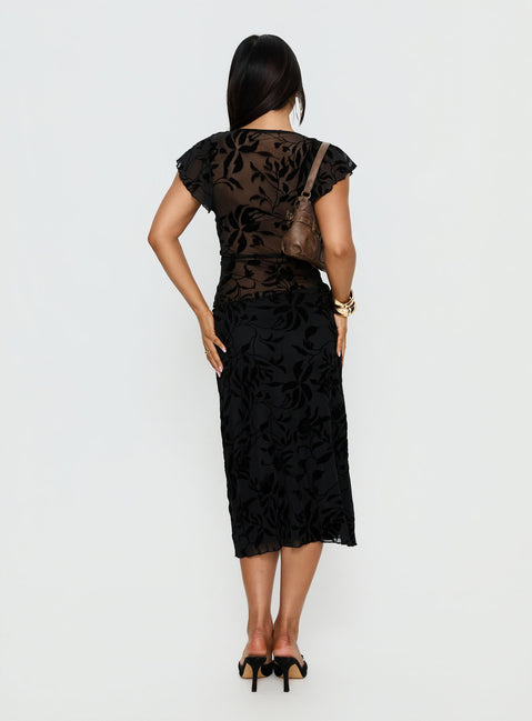 back view of model wearing Princess Polly Atira Midi Skirt Leaf Flower Black Midi Skirts Skirts 