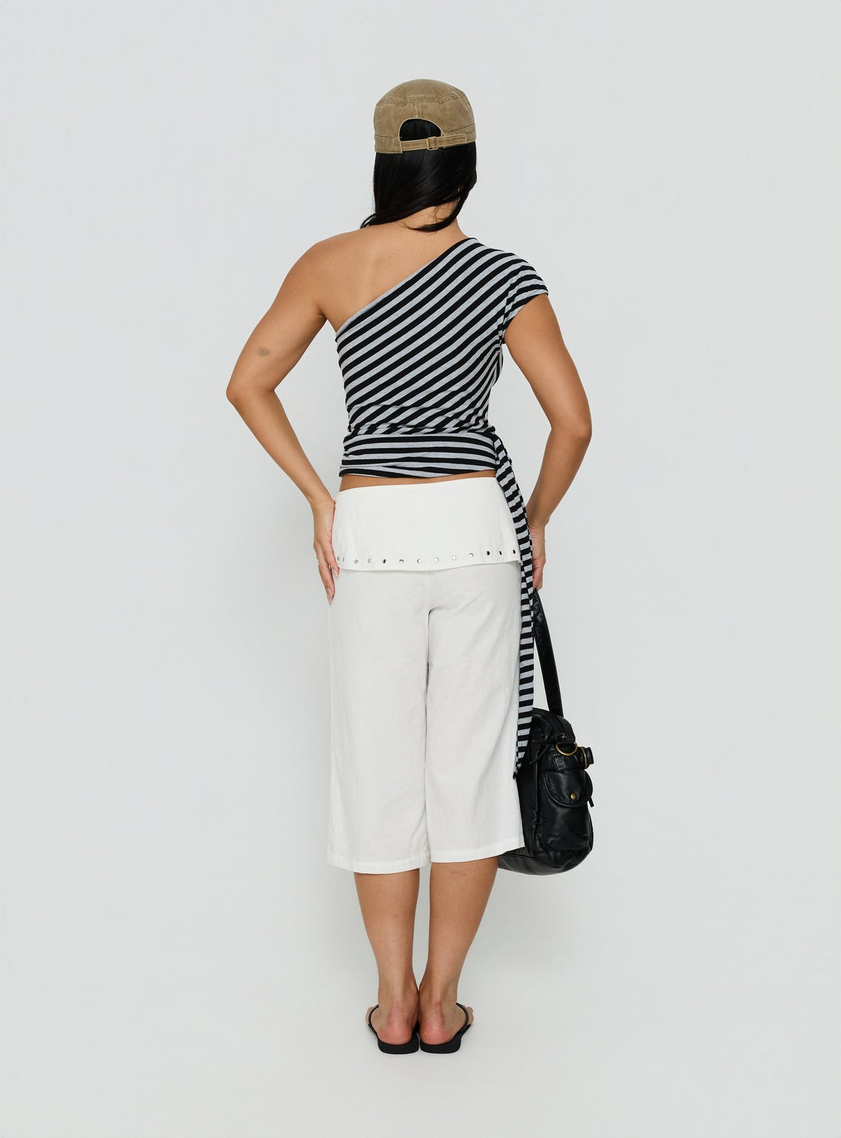 Designed with the Oren Capri Trouser Ivory womens-regular-pants featuring mid-rise and belt back view of model wearing Princess Polly
