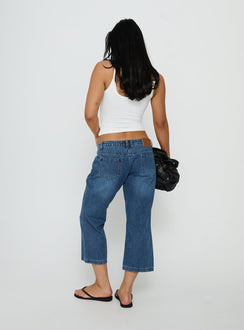 Designed for comfort, the Hierarchy Low Rise 3/4 Length Jeans Mid Wash womens-jeans back view of model wearing Princess Polly