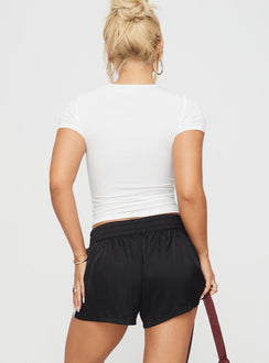 back view of model wearing Princess Polly 444 Shorts Black Low Rise Shorts 