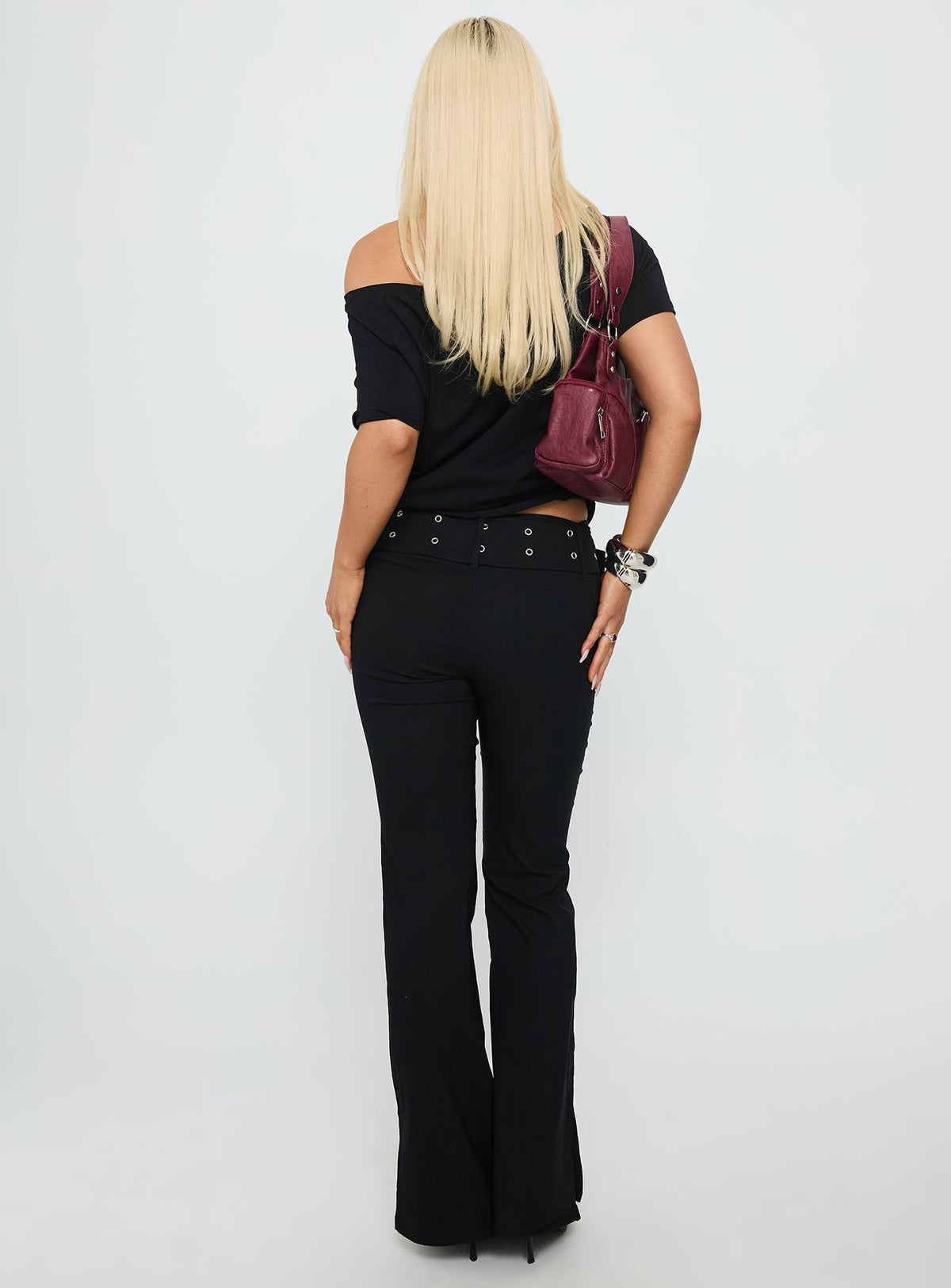 back view of model wearing Princess Polly Kortnee Eyelet Detail Flare Leg Pants Black Low Rise Pants Pants 