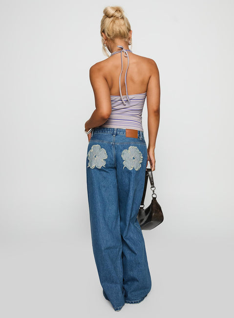 back view of model wearing Princess Polly A Keeper Flower Patch Low Rise Wide Leg Jeans Mid Blue Low Rise Jeans Jeans 