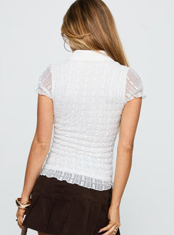 back view of model wearing Princess Polly Melaniya Button Up Top White Short Sleeves V-Neck 