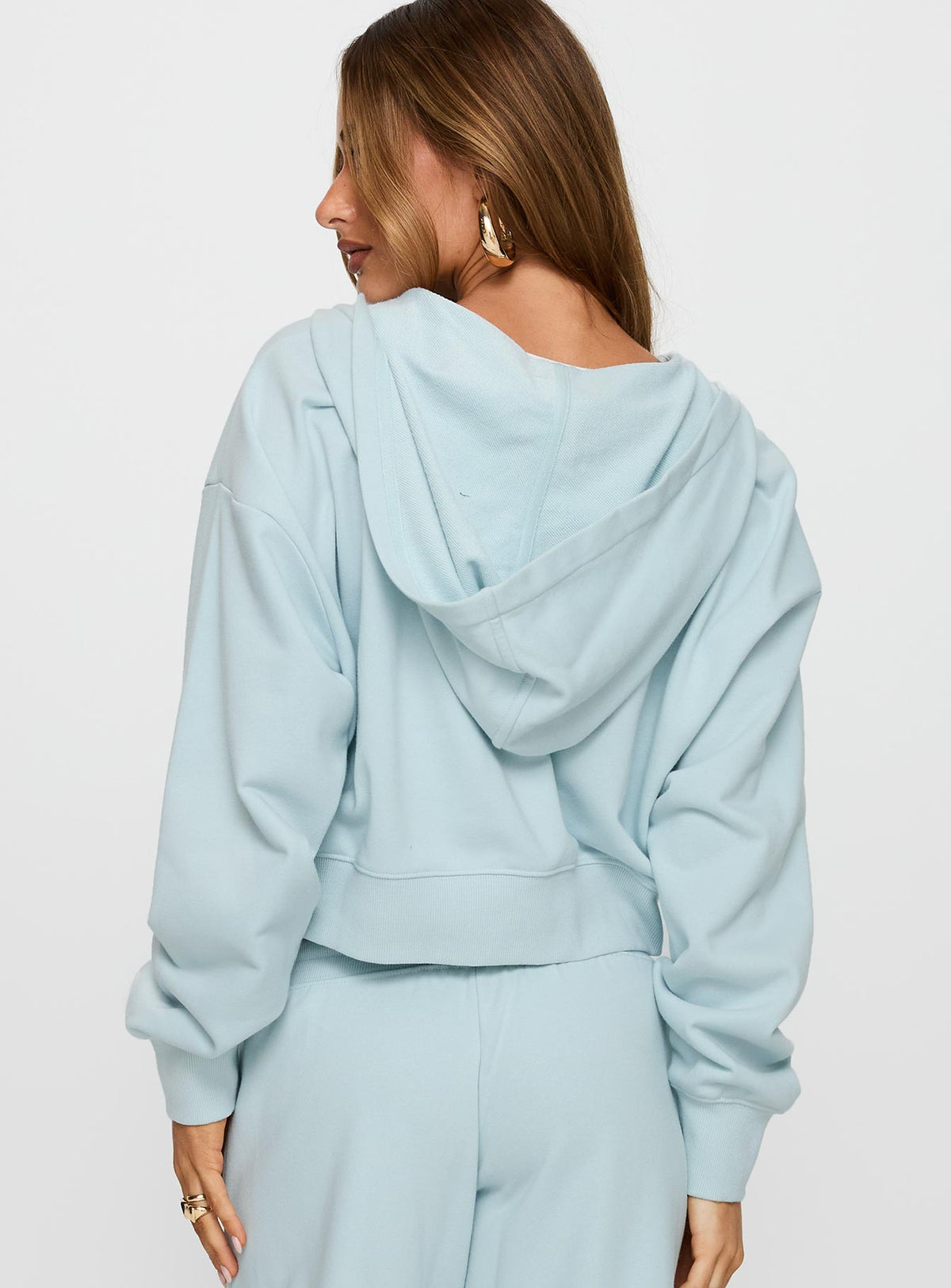 back view of model wearing Princess Polly Revive Zip Through Hoodie Blue cropped Jumpers 