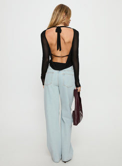back view of model wearing Princess Polly Penny Mid Rise Straight Leg Jeans Light Denim Low Rise Jeans 