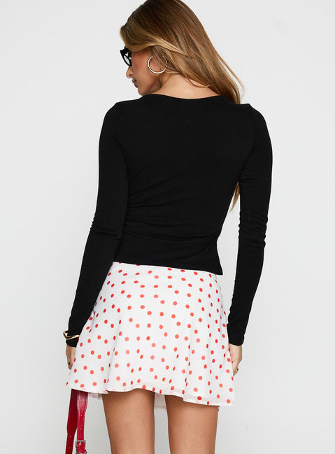 back view of model wearing Princess Polly Dapple Bias Mini Skirt White / Red Polka Mini Skirts Skirts 