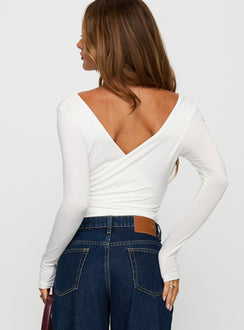 back view of model wearing Princess Polly Right Here Cross Detail Bodysuit White Long Sleeve Tops Bodysuit 