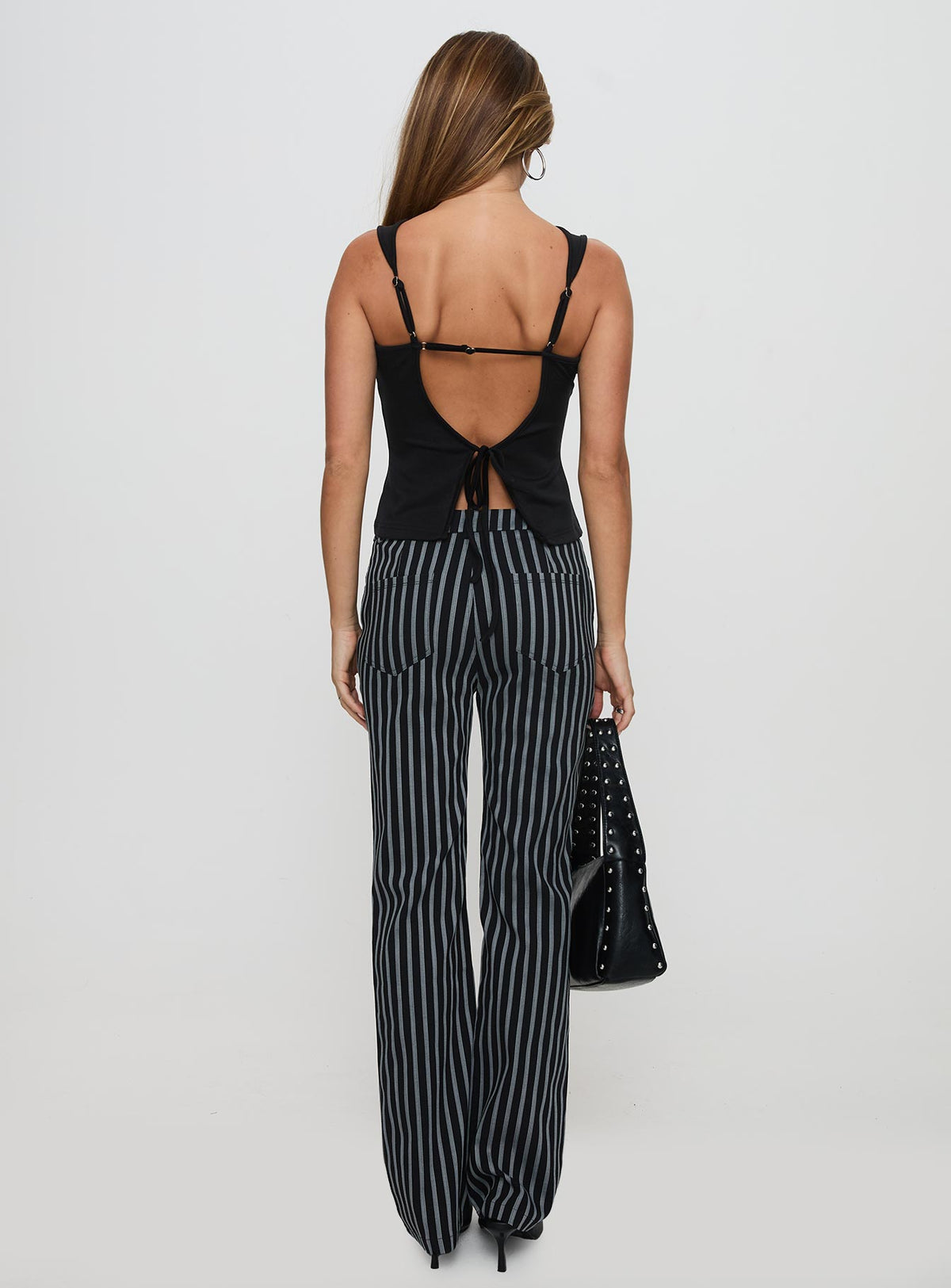 back view of model wearing Princess Polly Allude Low Waist Pinstripe Pant Black Low Rise Pants Pants 