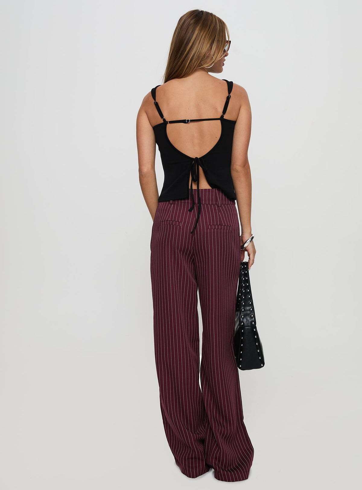 back view of model wearing Princess Polly Lorenne Mid Rise Pant Burgundy Pinstripe High Waisted Pants 