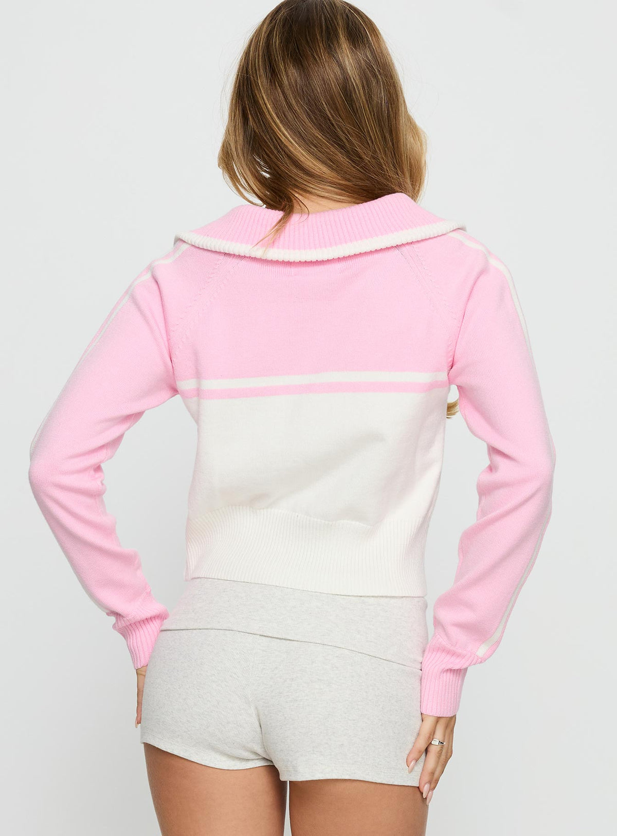 back view of model wearing Princess Polly Take The Lead Zip Through Knit Sweater Pink / White Cropped Jumpers Jumpers 