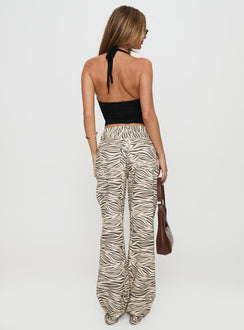 back view of model wearing Princess Polly Top Model Low Rise Straight Leg Jeans Zebra Mid Rise Jeans Jeans 