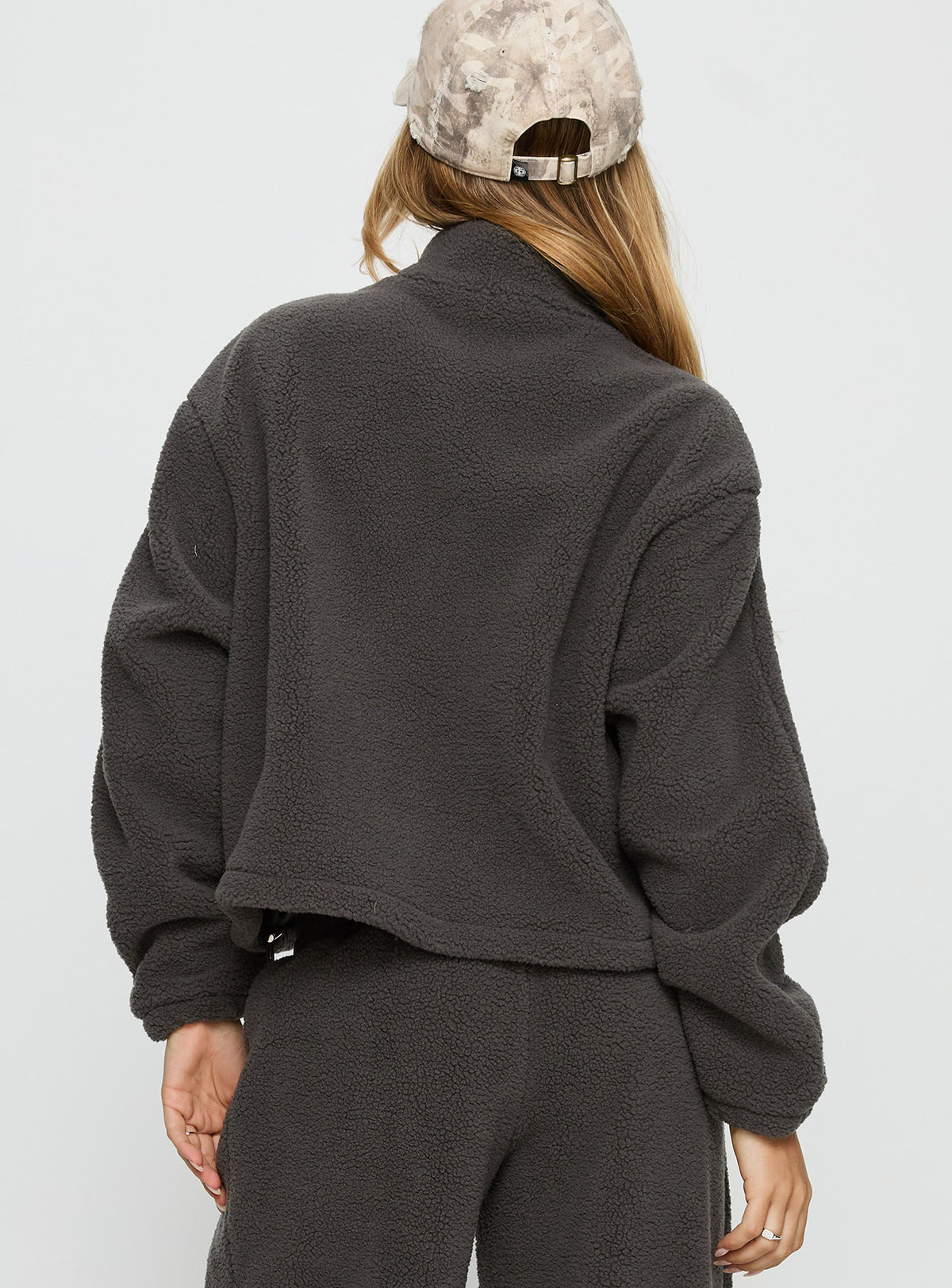 back view of model wearing Princess Polly Siberia Fleece Zip Up Jumper Charcoal regular Jumpers 