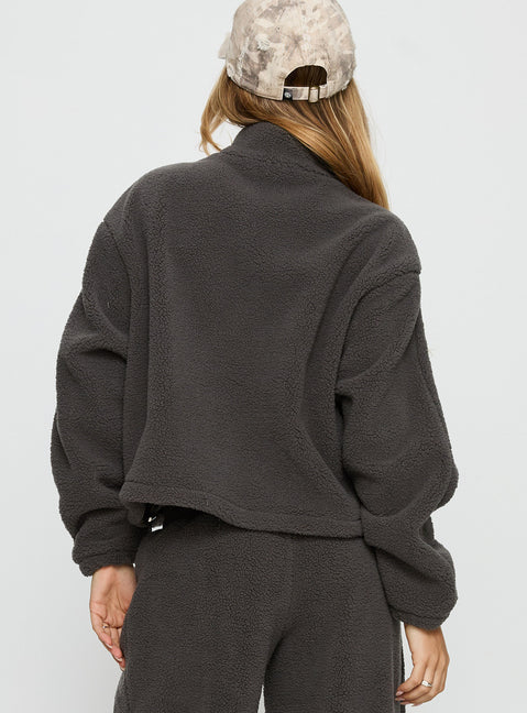 back view of model wearing Princess Polly Siberia Fleece Zip Up Jumper Charcoal regular Jumpers 