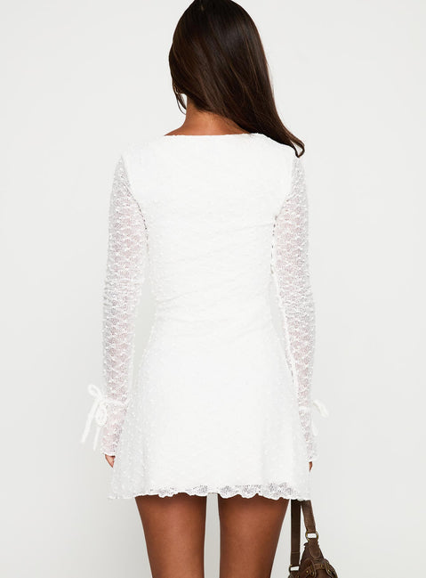 back view of model wearing Princess Polly Dalzine Long Sleeve Mini Dress White Sweetheart Neckline 