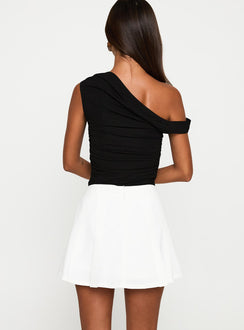 back view of model wearing Princess Polly Barrymore Mini Skort White Low Rise Shorts 