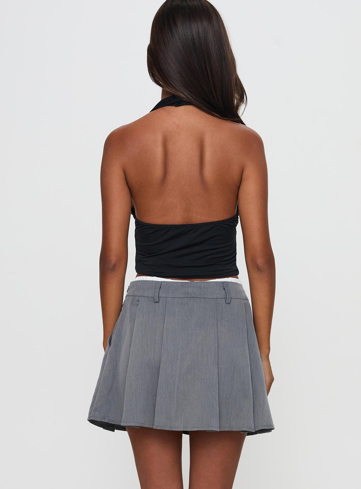 back view of model wearing Princess Polly Simulations Pleated Mini Skirt Grey Mini Skirts Skirts 