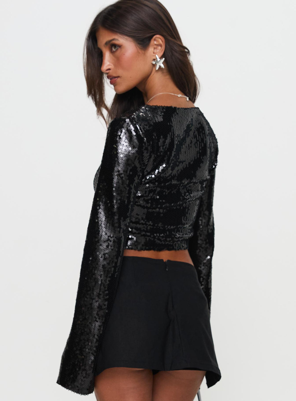 back view of model wearing Princess Polly Zenobia Long Sleeve Sequin Top Black Full Sleeves Scoop Neck 