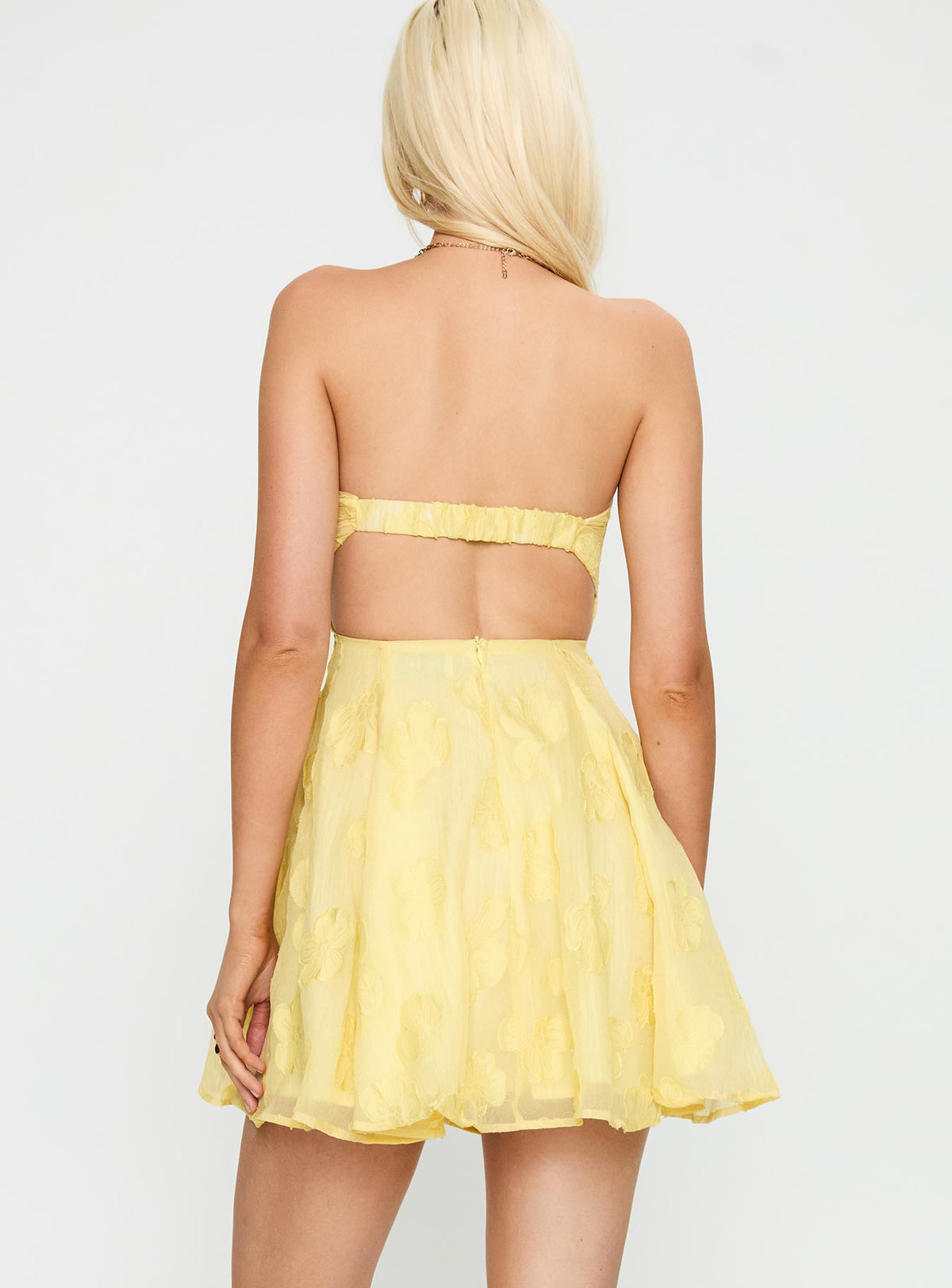 back view of model wearing Princess Polly Loulani Strapless Mini Dress Lemon Sweetheart Neckline 