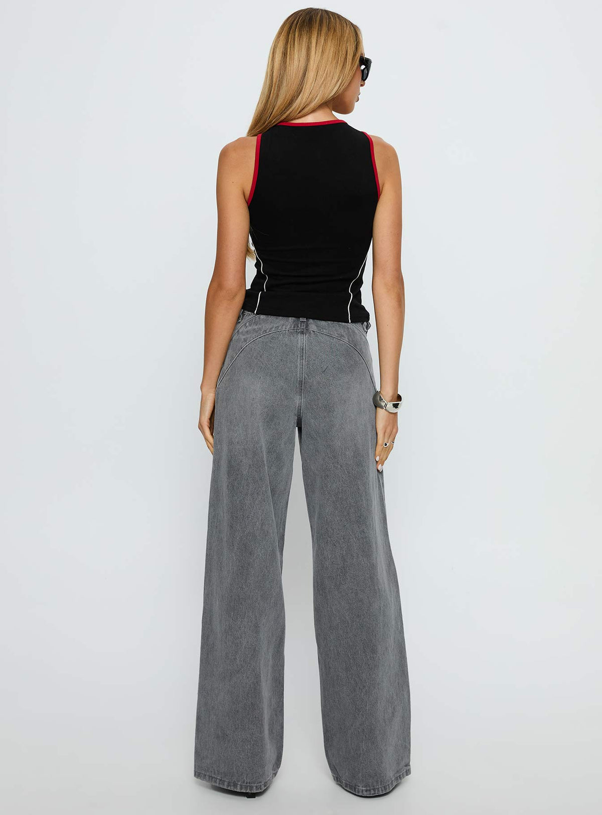 back view of model wearing Princess Polly Mckinley Mid Rise Wide Leg Jeans Washed Grey Mid Rise Jeans 