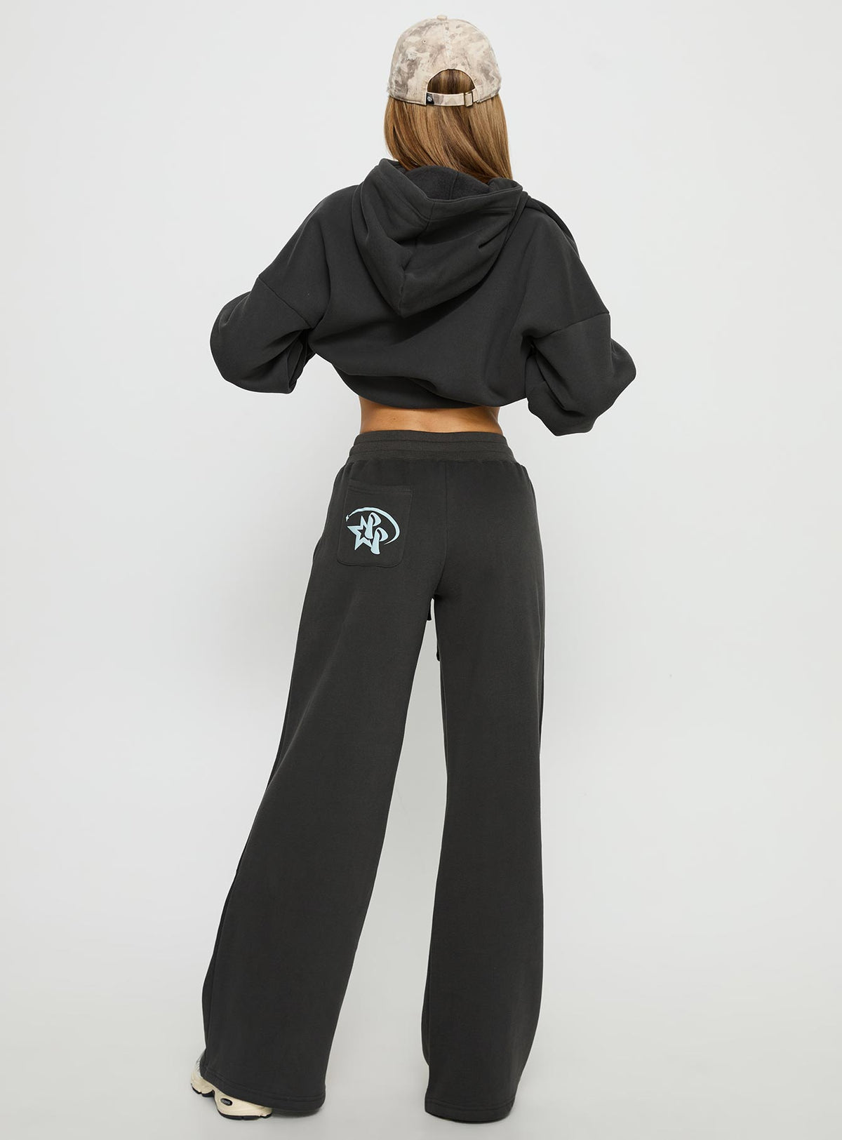 back view of model wearing Princess Polly Princess Polly Stargirl Wide Leg Sweat Pants Charcoal High Rise Pants Pants 