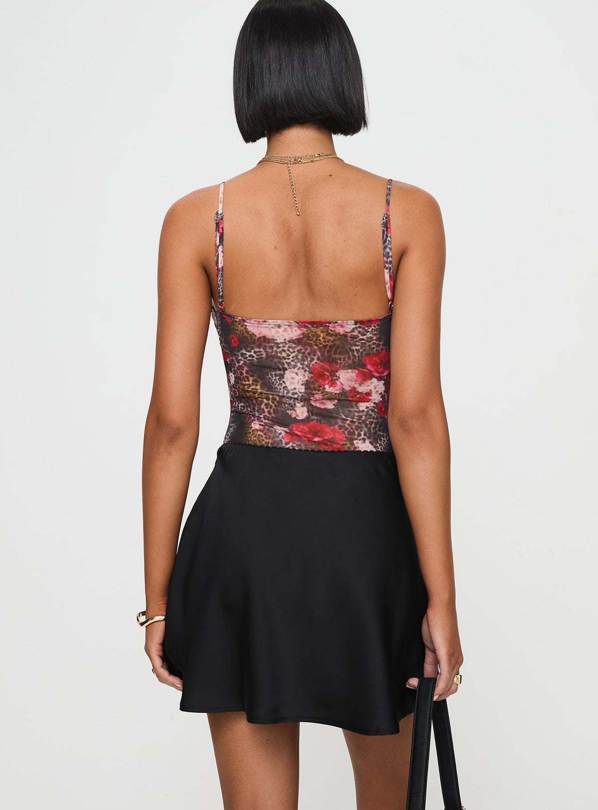 back view of model wearing Princess Polly Dapple Bias Satin Mini Skirt Black Mini Skirts Skirts 