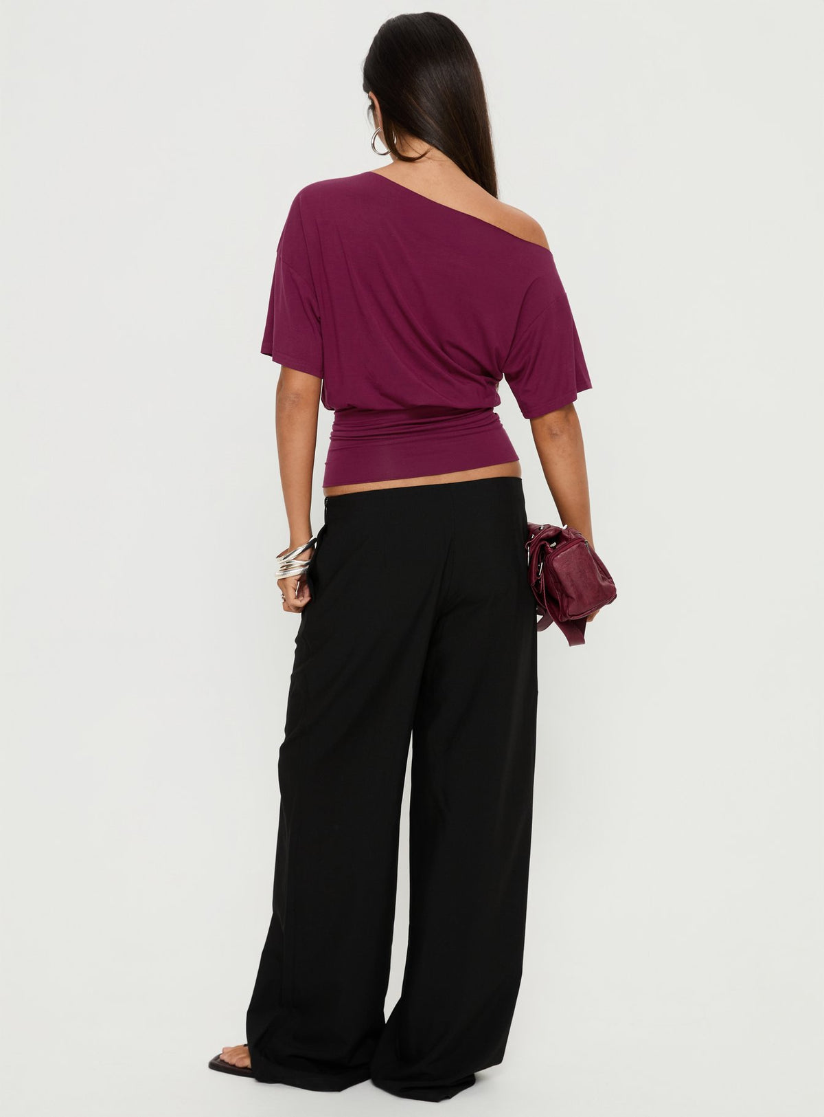 Showcasing the Khane Low Rise Wide Leg Pant Black Petite in womens-regular-pants front view of model wearing