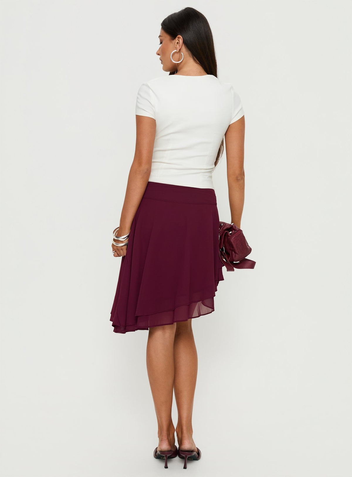 back view of model wearing Princess Polly Evanescence Asymmetrical Midi Skirt Cherry 