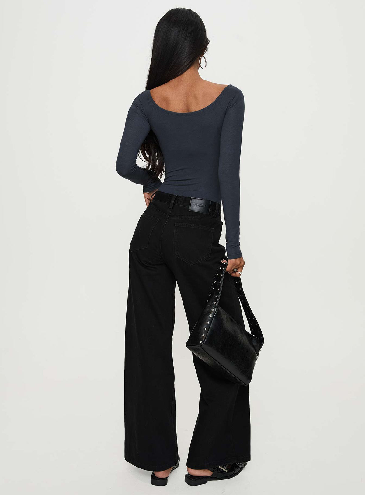 back view of model wearing Princess Polly Colemane Mid Rise Wide Leg Jeans Black High Rise Jeans Jeans 