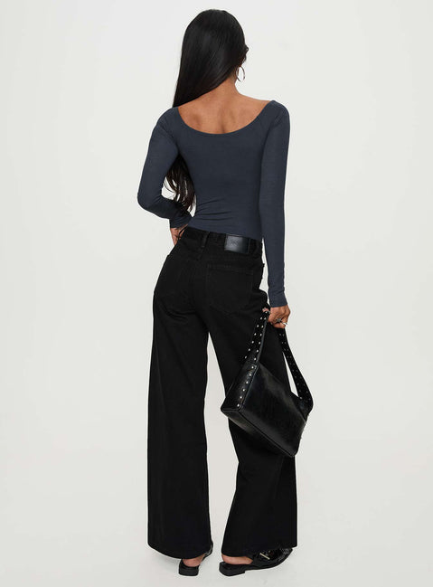 back view of model wearing Princess Polly Colemane Mid Rise Wide Leg Jeans Black High Rise Jeans Jeans 