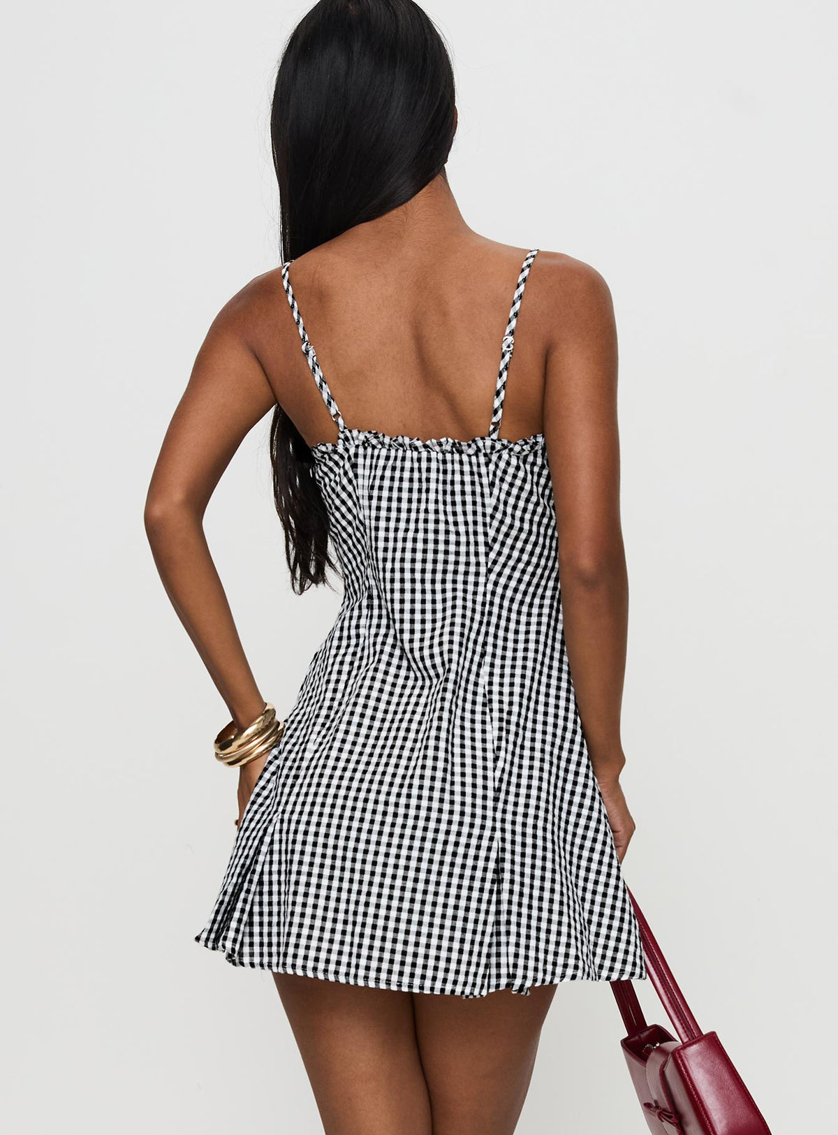 back view of model wearing Princess Polly Bessette Mini Dress Black Gingham Square Neck 