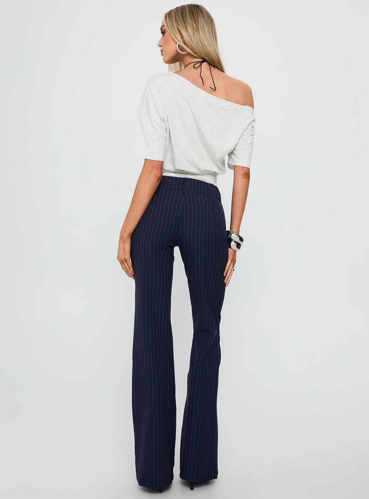 back view of model wearing Princess Polly Kinkirk Flared Pants Navy Pinstripe Low Rise Pants Pants 