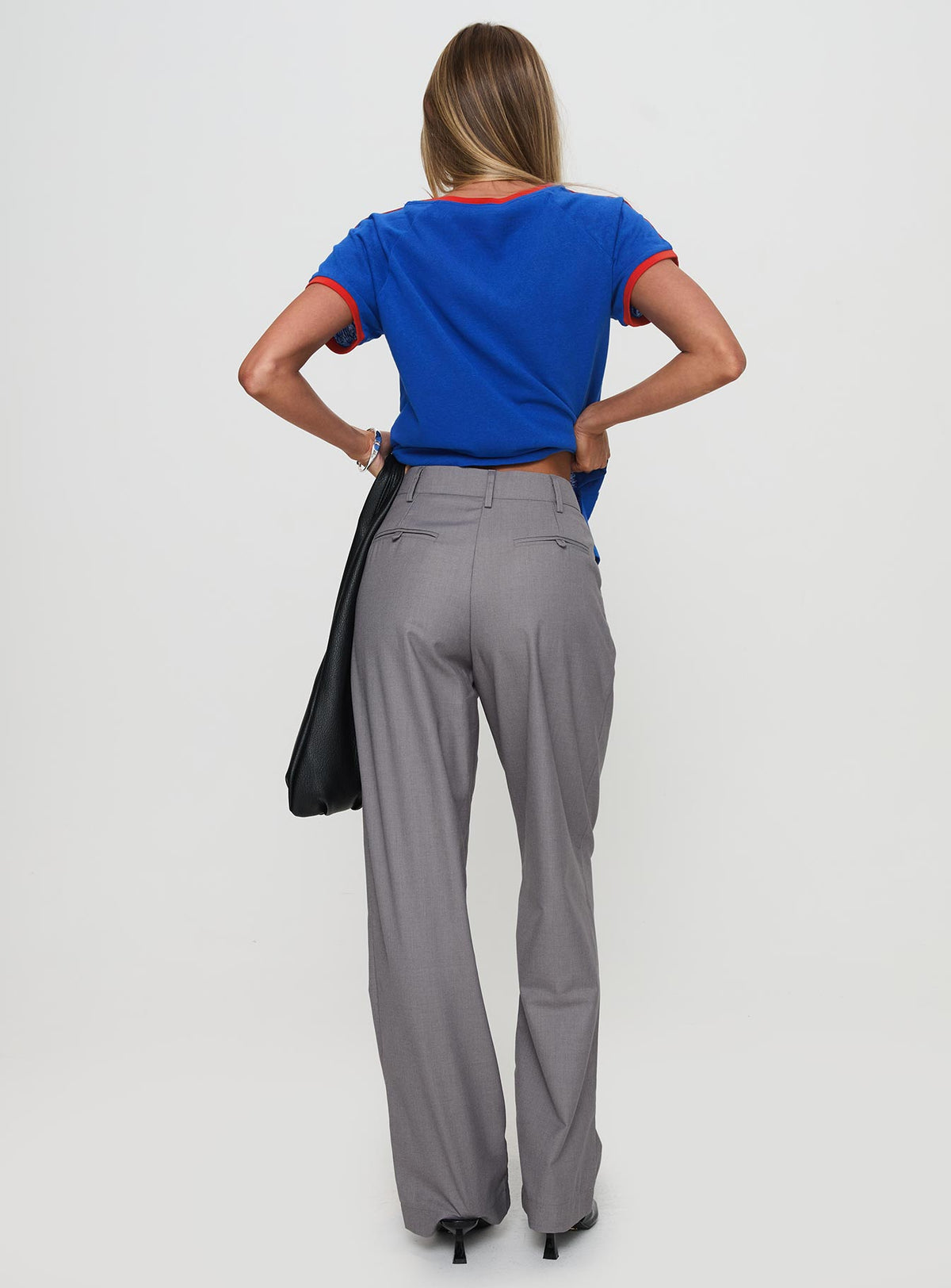 back view of model wearing Princess Polly Expertise Low Rise Pleat Pant Grey High Rise Pants Pants 