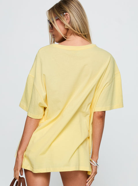 back view of model wearing Princess Polly Amalfi Coast Oversized Graphic Tee Pastel Yellow Half Sleeves Crew Neck 