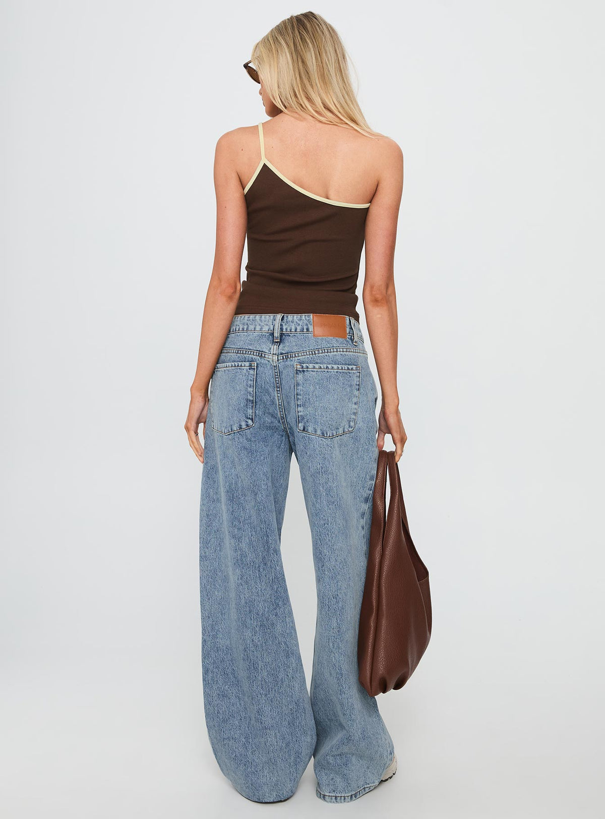back view of model wearing Princess Polly Shima Low Rise Straight Leg Jeans Light Wash Low Rise Jeans Jeans 
