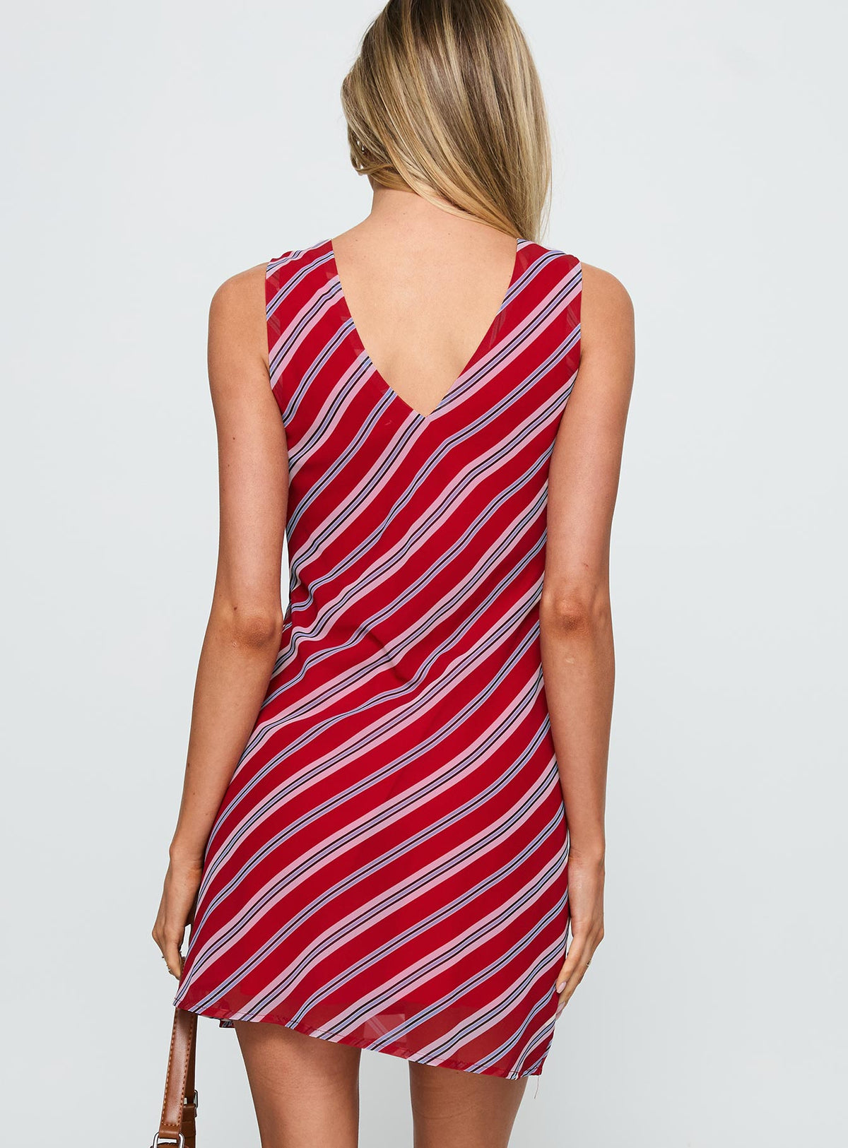back view of model wearing Princess Polly Nadiah Mini Dress Red Stripe V-Neck 