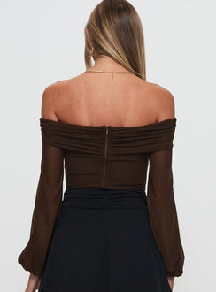 Designed with full sleeves and ruched features, the Babette Off The Shoulder Bodysuit in Brown womens-bodysuit back view of model wearing