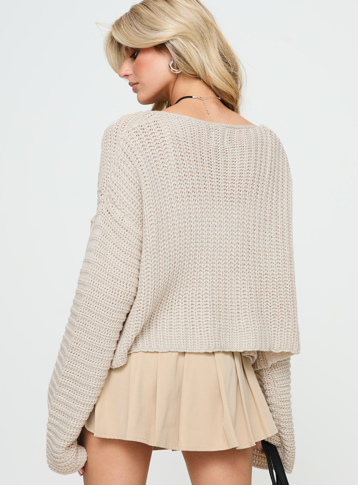 Displaying the Artha Cardigan Beige womens-jumpers with short length back view of model wearing Princess Polly