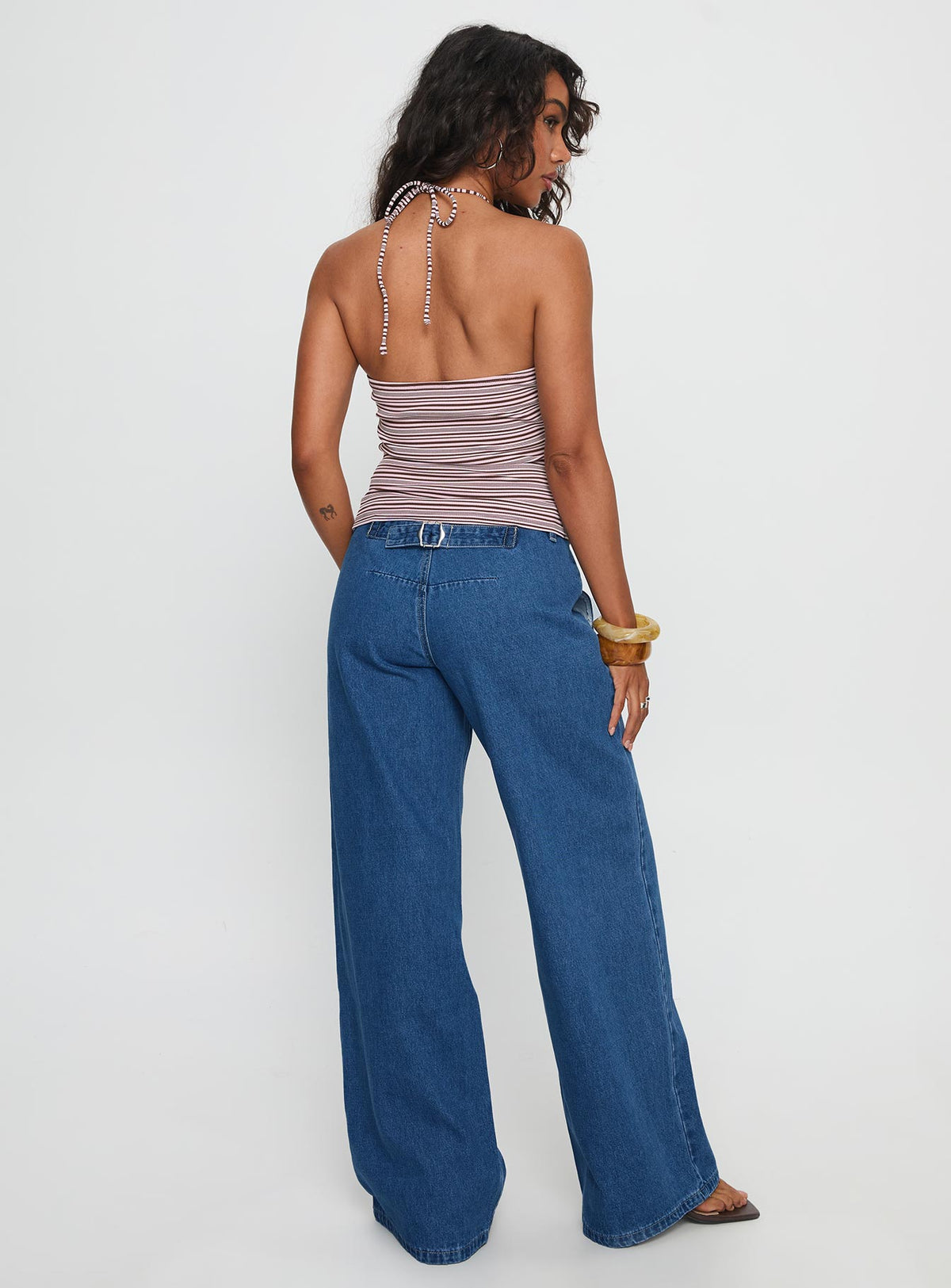 back view of model wearing Princess Polly Polaris Mid Rise Straight Leg Jeans Mid Blue Mid Rise Jeans Jeans 
