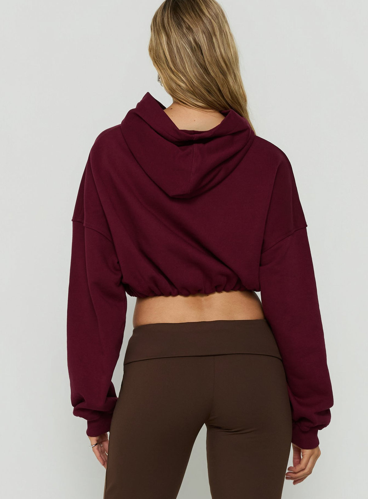 Showcasing the Mayse Bubble Hem Cropped Hoodie Cherry womens-jumpers in short length back view of model wearing Princess Polly