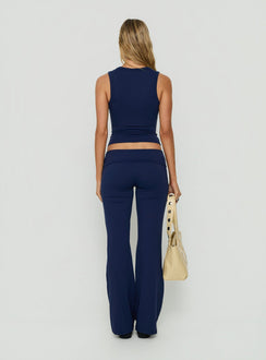 Highlighting the Daily Define Foldover Waist Pants Navy womens-regular-pants in high-rise wide-leg style back view of model wearing Princess Polly
