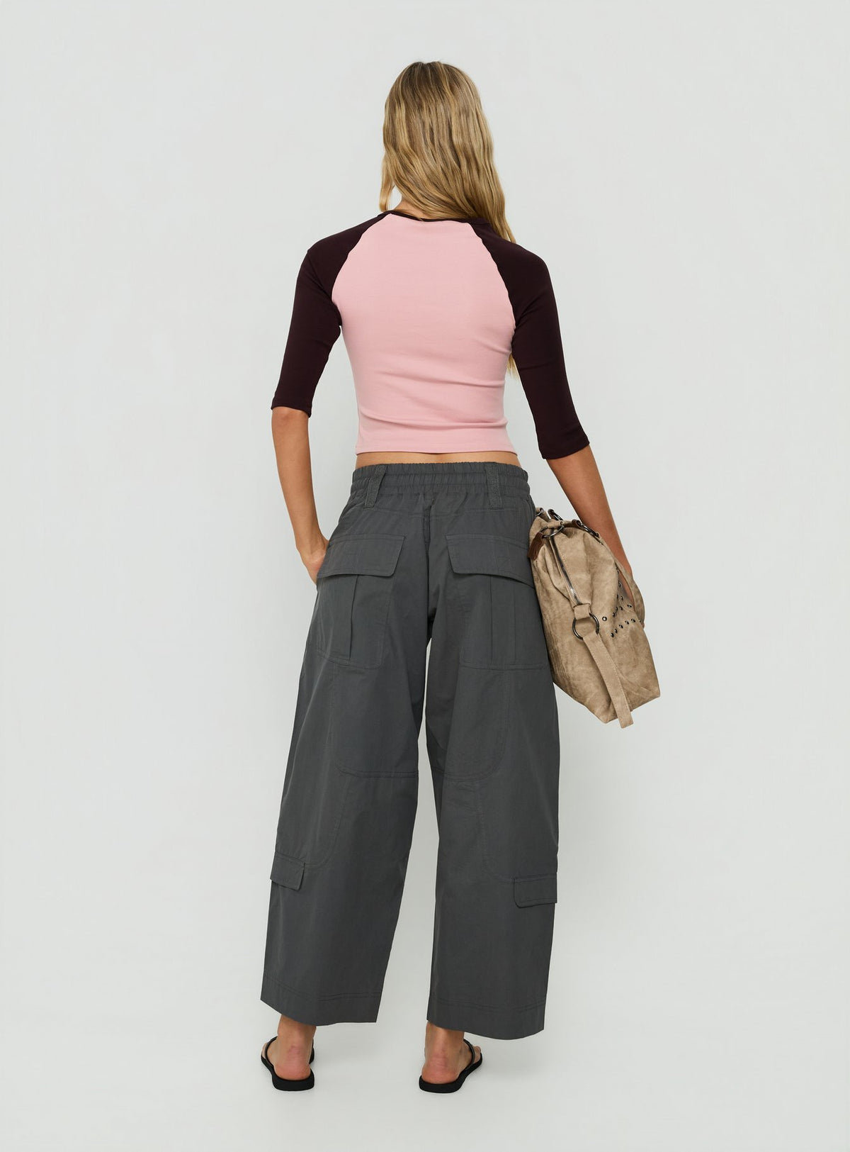 Presenting Fever Cargo Pant Charcoal womens-regular-pants with high-rise back view of model wearing Princess Polly