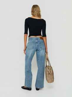Presenting Serenitia Mid Rise Relaxed Jeans in Bright Blue womens-jeans with mid-rise waist back view of model wearing