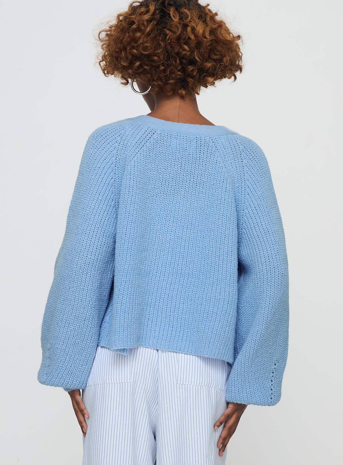 back view of model wearing Princess Polly Leskie Cardigan Pale Blue Cropped Jumpers Jumpers 