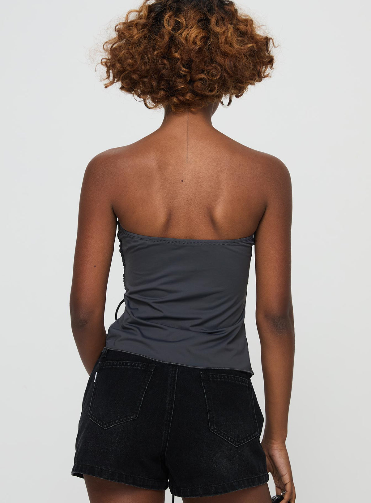 back view of model wearing Princess Polly Dessy Strapless Top Slate Sleeveless straight 