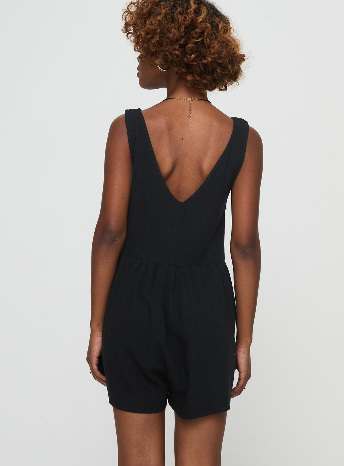 Romper Fixed shoulder straps, v-neckline, tie fastening at bust, invisible zip fastening at side, twin hip pockets Non-stretch material, unlined 