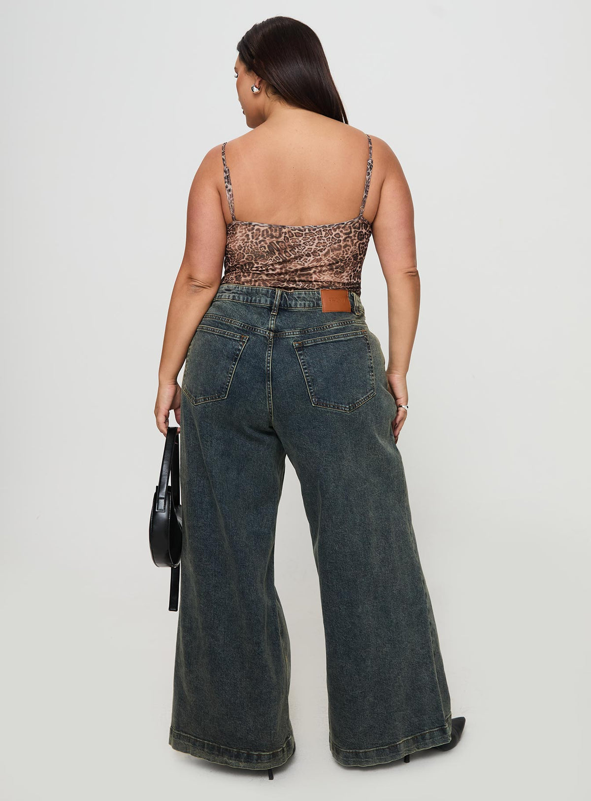 back view of model wearing Princess Polly Ziggie Low Rise Baggy Jeans Antique Wash Curve High Rise Jeans Jeans 