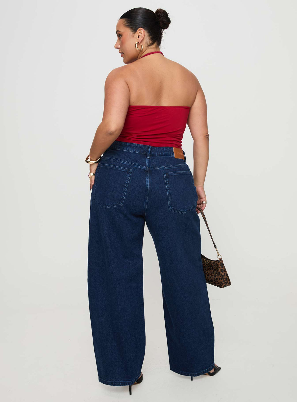 back view of model wearing Princess Polly Britta Mid Rise Tapered Leg Jeans Dark Wash Curve High Rise Jeans Jeans 