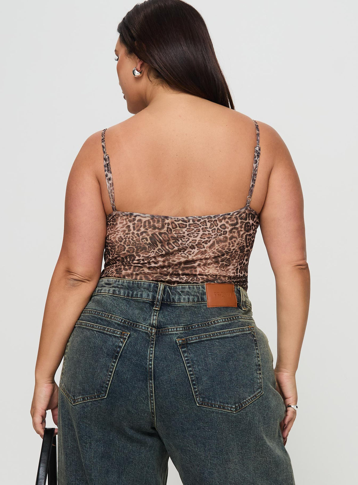 back view of model wearing Princess Polly Elixia Bodysuit Leopard Curve Sleeveless Bodysuit 